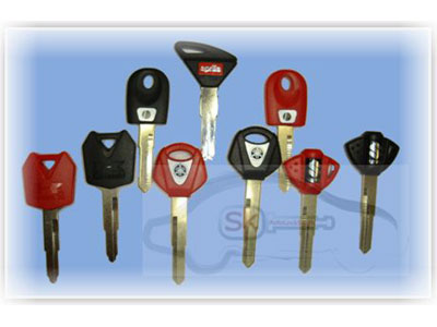 selection of motorcycle keys on blue background